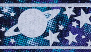 A swatch depicting a dark galaxy‑themed pattern. A large reflective gray planet with rings appears at the center, surrounded by reflective gray stars of various shapes against a navy and indigo mottled background. The edges of the pattern are accentuated with a textured blue border, giving the swatch a graphic, cosmic look.