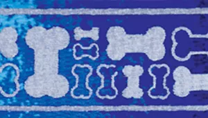 A swatch showing a lively dog‑bone pattern made out of reflective gray material. The design includes large and small bone shapes that appear outlined in navy and filled with lighter sky‑blue tones. The background is a textured graduated blue material. The layering of blue hues gives the swatch a dynamic, playful look.