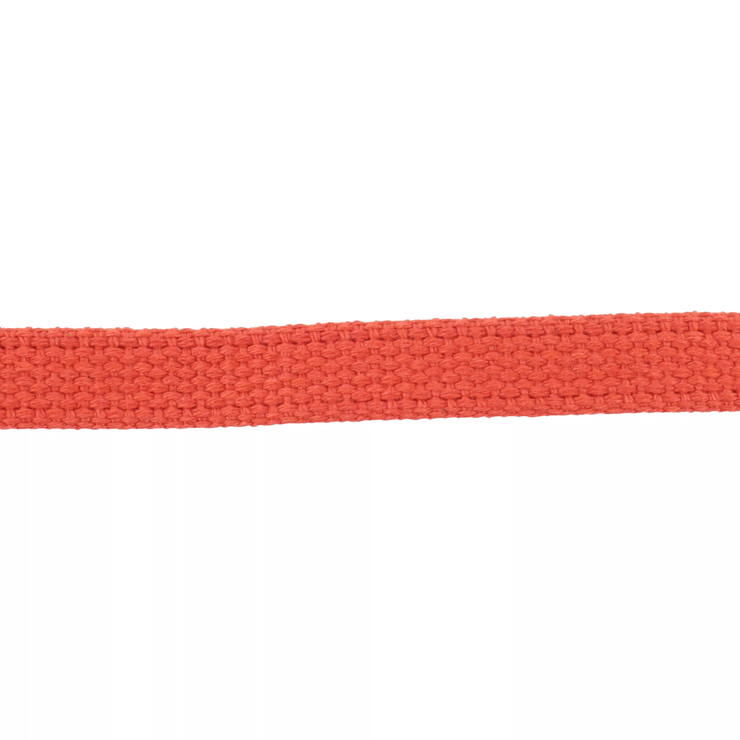 A close‑up view of red cotton webbing is displayed against a white background. The material is flat, tightly woven cotton fabric in a solid red color. The weave pattern is visible, with horizontal and vertical fibers forming a uniform texture. No hardware or additional components appear in the image.