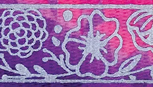 A swatch displaying an intricate floral pattern in jewel‑tone pink, purple, and white. Stylized flowers with detailed linework and multiple petal layers cover the surface. The background is a gradient mix of magenta and purple, giving the swatch a vivid, richly textured appearance.