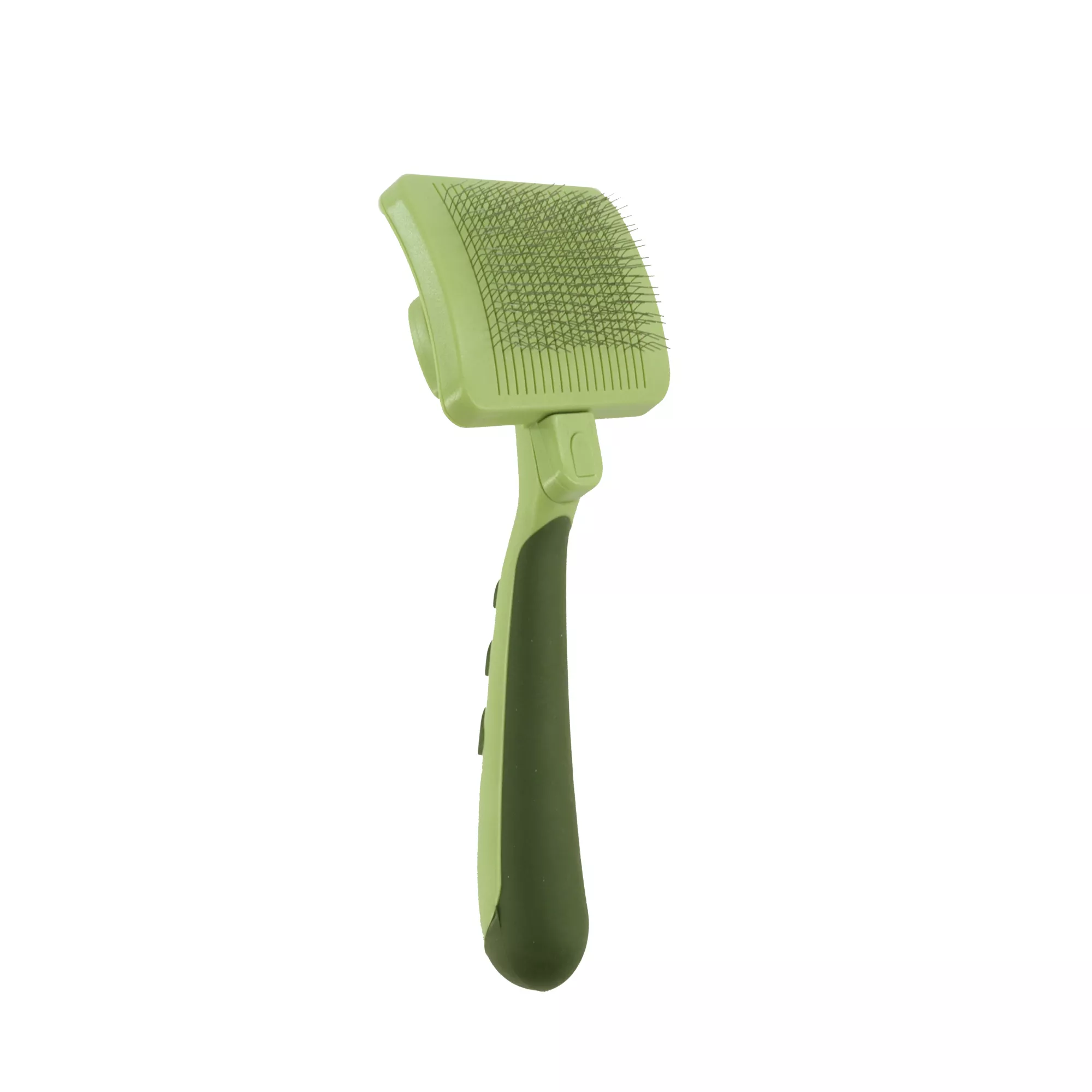 A pale green self‑cleaning slicker brush is shown in a three‑quarter angled view against a white background. The brush head contains dense metal bristles, and the handle has darker green textured grip areas.