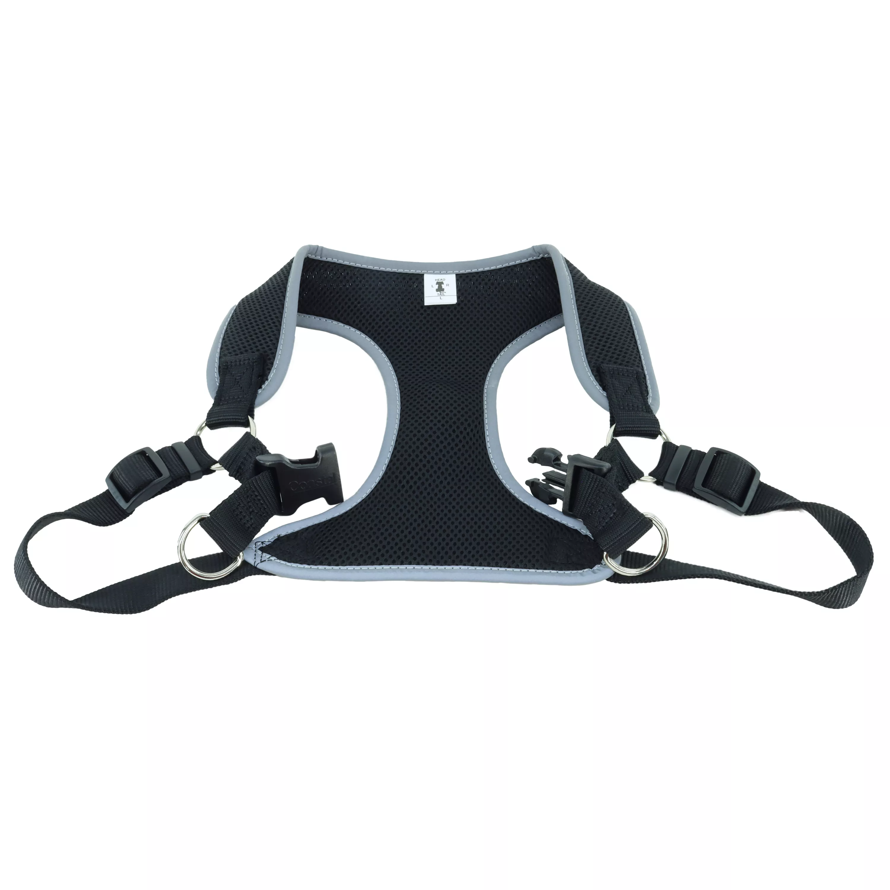 A product‑only image of a black Comfort Soft Reflective Wrap adjustable dog harness displayed against a white background. The harness shows a padded black mesh chest panel with reflective trim, black woven straps with adjustment sliders, and a black plastic buckle in an open position. The silver‑tone D‑ring is positioned at the top of the back strap.