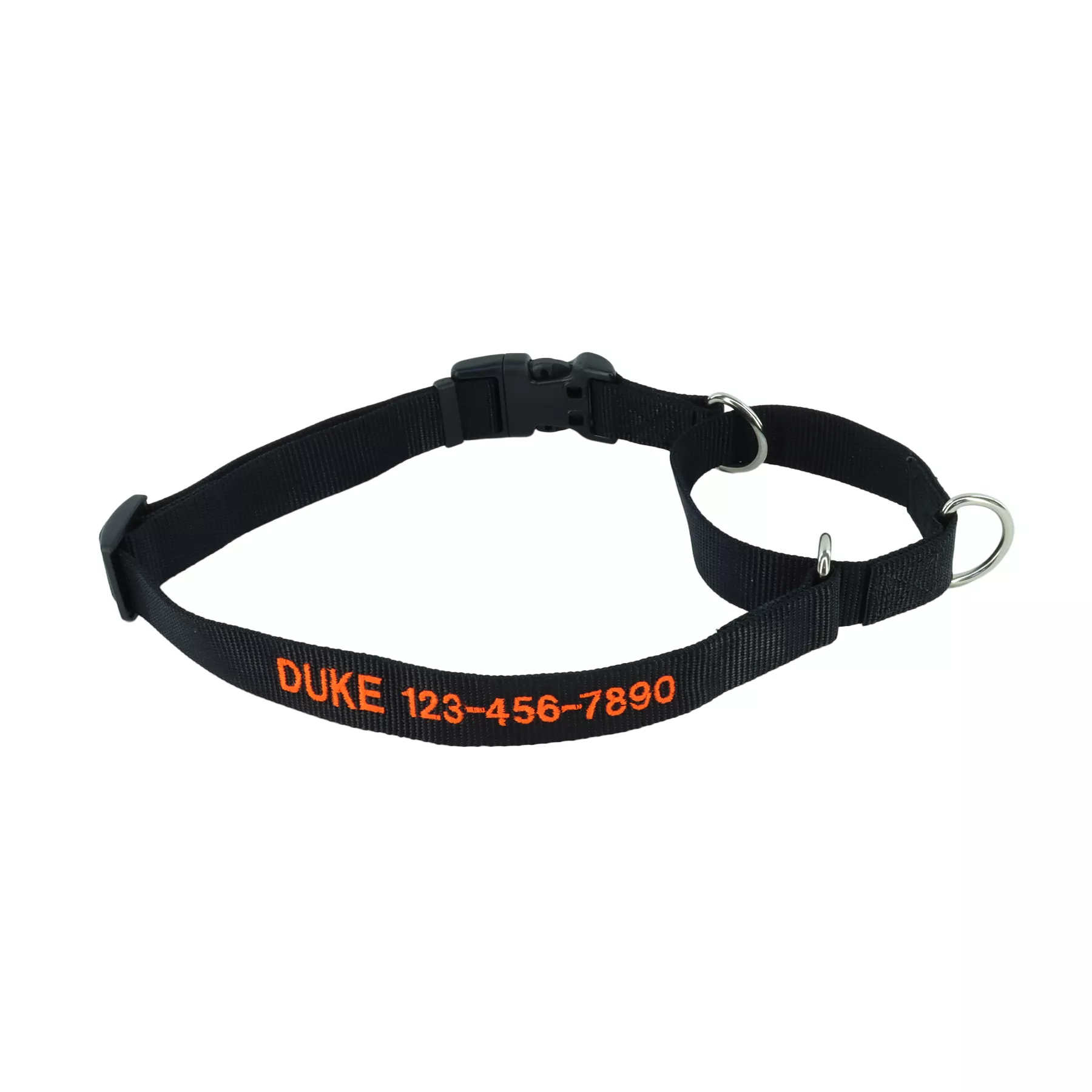 A product photograph of a black adjustable dog collar with a buckle, displayed on a white background. The collar is made of matte woven fabric in solid black. It includes a black plastic side‑release buckle, a black plastic slide adjuster, and a silver metal D‑ring. Orange embroidered text on the fabric reads: “DUKE 123‑456‑7890.”