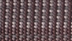 A swatch shows  material in a Mountain colorway. The rope appears dark gray with lighter gray reflective strands integrated throughout the braid. The texture is tightly woven with evenly spaced ridges running perpendicular to the rope length.