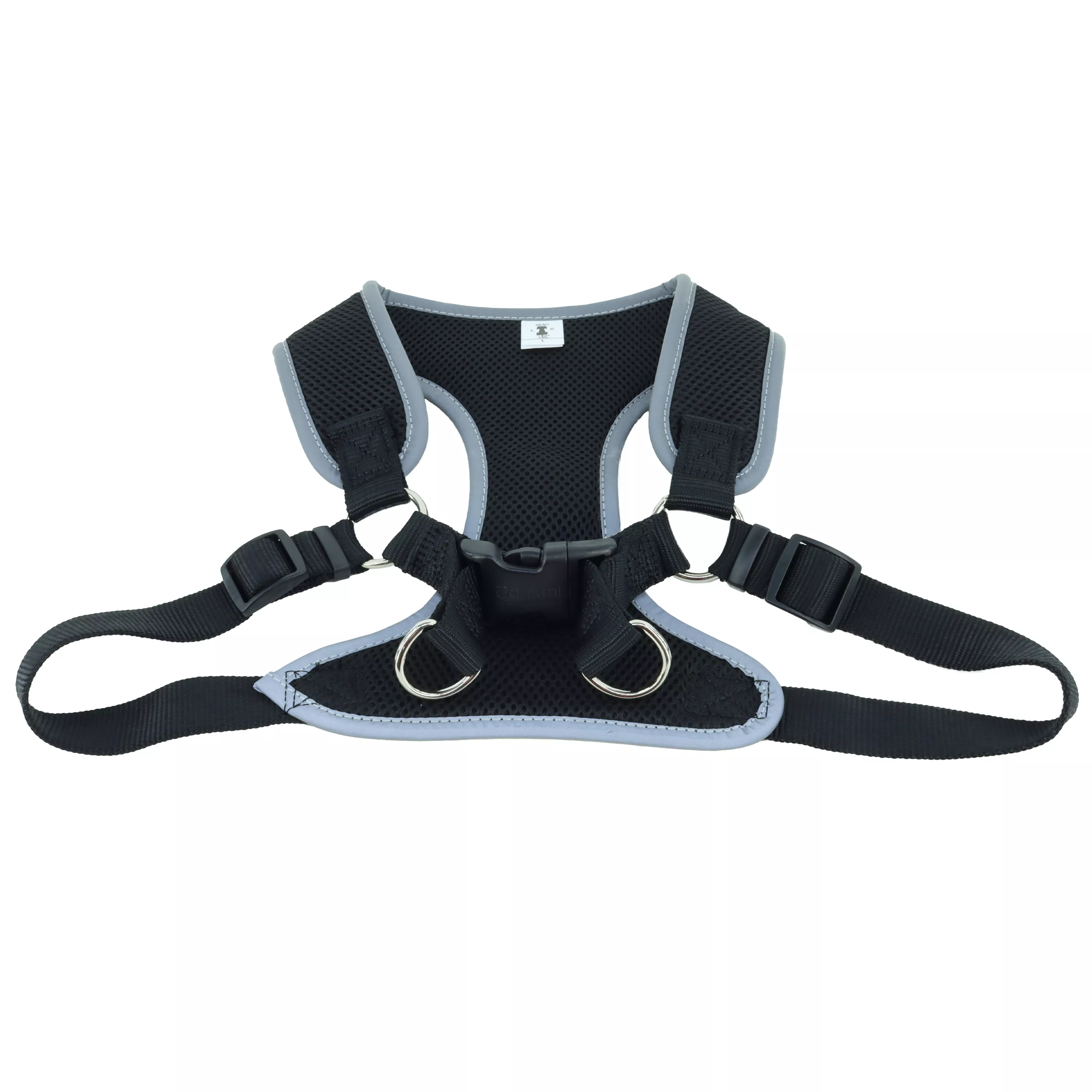 A product‑only image of a black Comfort Soft Reflective Wrap adjustable dog harness displayed against a white background. The harness includes a padded black mesh chest panel with reflective trim along the edges. Black woven straps with black plastic adjustment hardware connect the mesh sections. A black side‑release buckle secures the girth strap, and a silver‑tone metal D‑ring is centered on the back strap. The wrap‑style design is shown fully extended to reveal its structure.