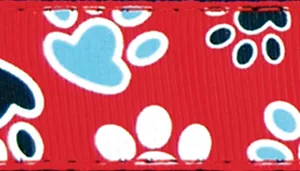 A swatch showing a close‑up of woven fabric printed with red, white, blue, and black paws.