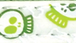 A narrow white ribbon-style material is shown with a repeating green skull pattern. The design includes stylized skull shapes in varying shades of green, some with circular eyes and simple line details. Additional small green elements resembling geometric shapes and accents appear along the length of the material. The surface includes visible stitched edges in matching white thread.