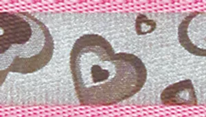 A swatch displays reflective woven fabric with a repeating heart and bone motif. The base fabric appears light gray with metallic reflective properties. The pattern includes heart shapes and bone shapes in darker gray tones. A bright pink fabric edge runs along the top and bottom of the swatch.
