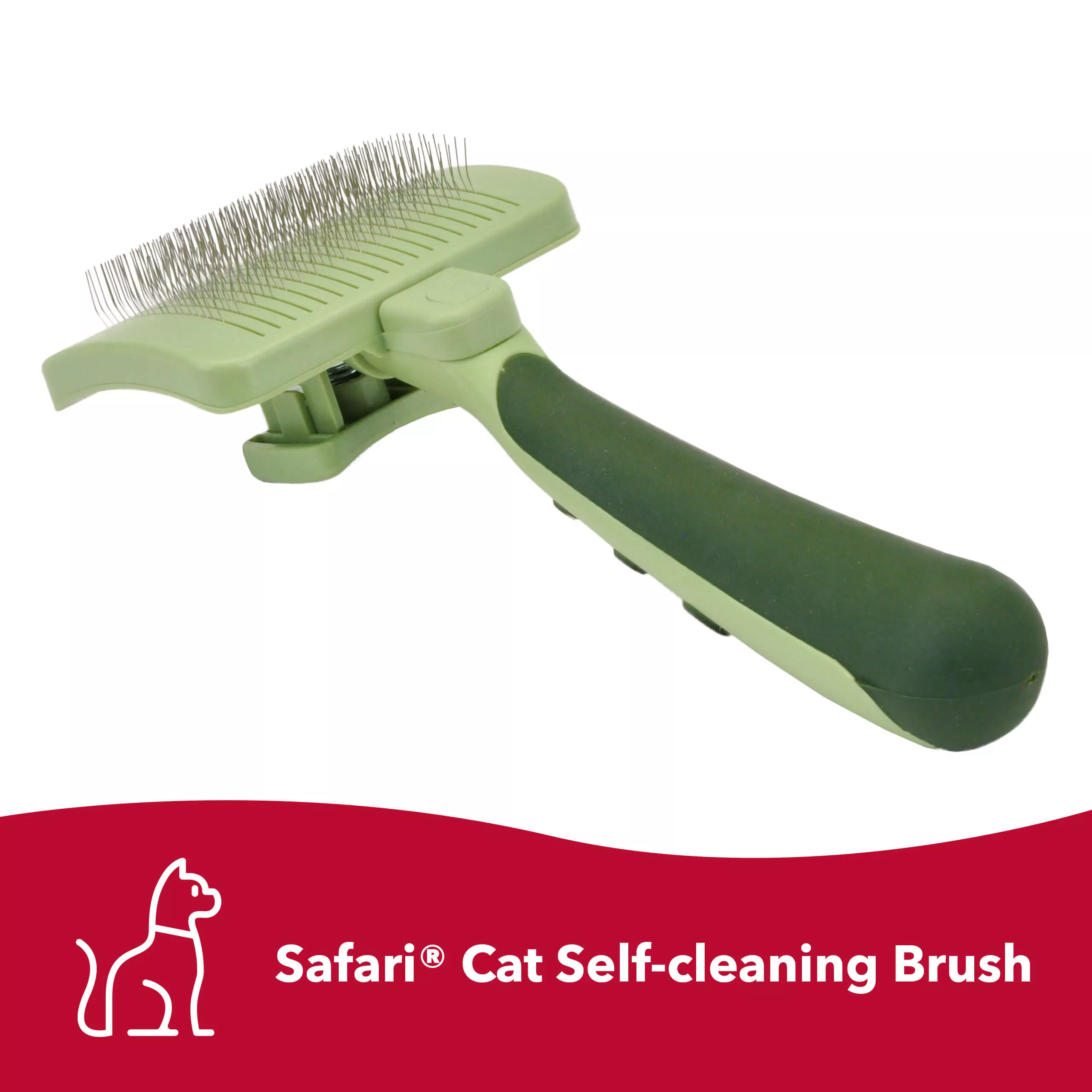A pale green cat self‑cleaning slicker brush rests on a gray fuzzy surface. Clumps of shed fur lie beside the brush. The brush has a rectangular head with fine metal bristles and a pale green handle with darker green grip areas. A red banner at the bottom contains white text reading “Safari® Cat Self‑cleaning Brush.”