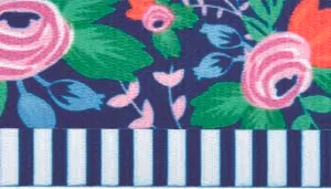 A swatch showing a close‑up of fabric with teal vertical stripes and a floral pattern. Pink and purple flowers with green leaves appear across the striped background, with visible woven texture.