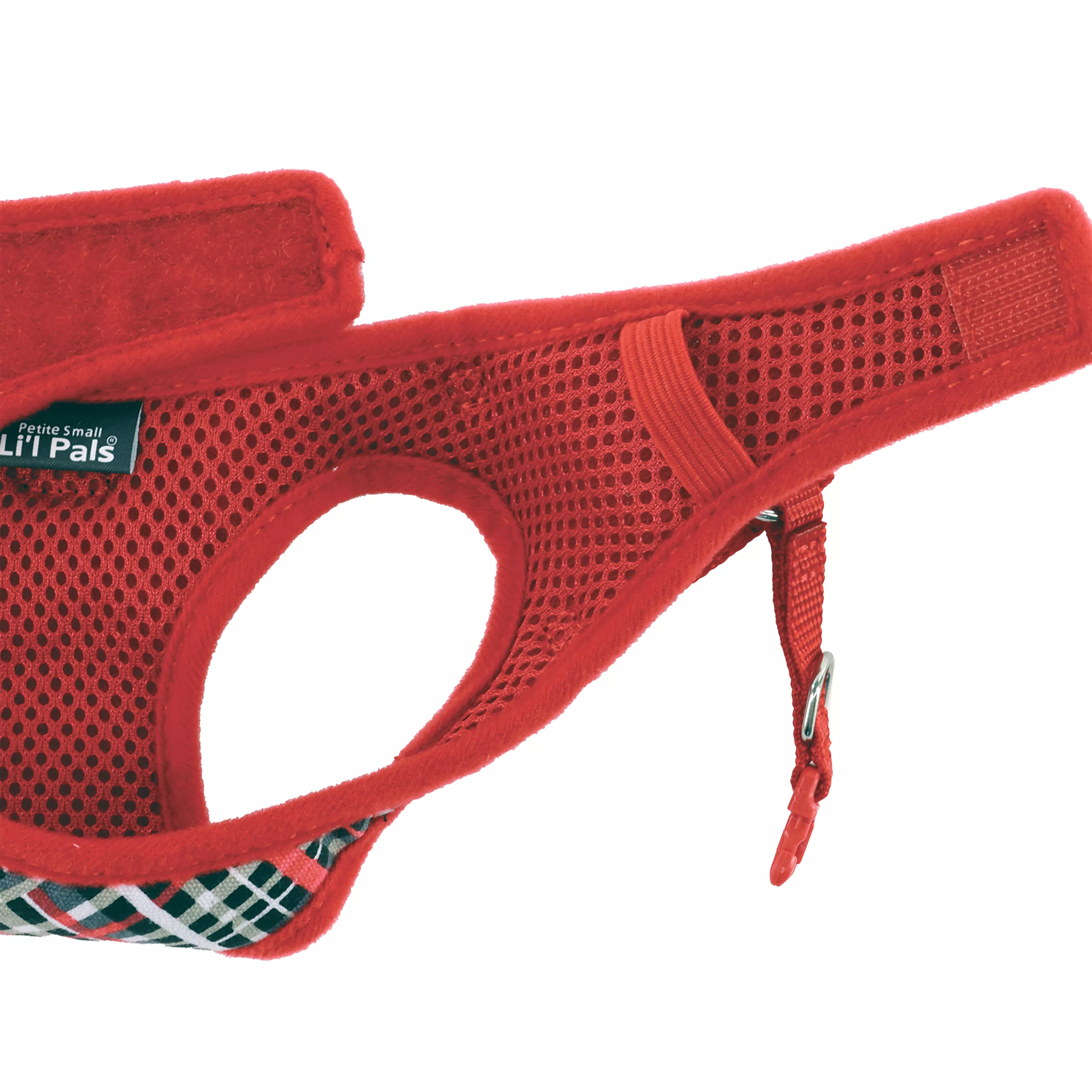 Product image of the Li'l Pals Canvas Dog Harness in Red and Grey Plaid, shown at an angled view on a white background. The harness features a red canvas body with breathable mesh panels and a front chest patch in a red, grey, and white plaid pattern. It includes red trim, black plastic adjustment buckles, and a silver metal D‑ring positioned at the top for leash attachment.