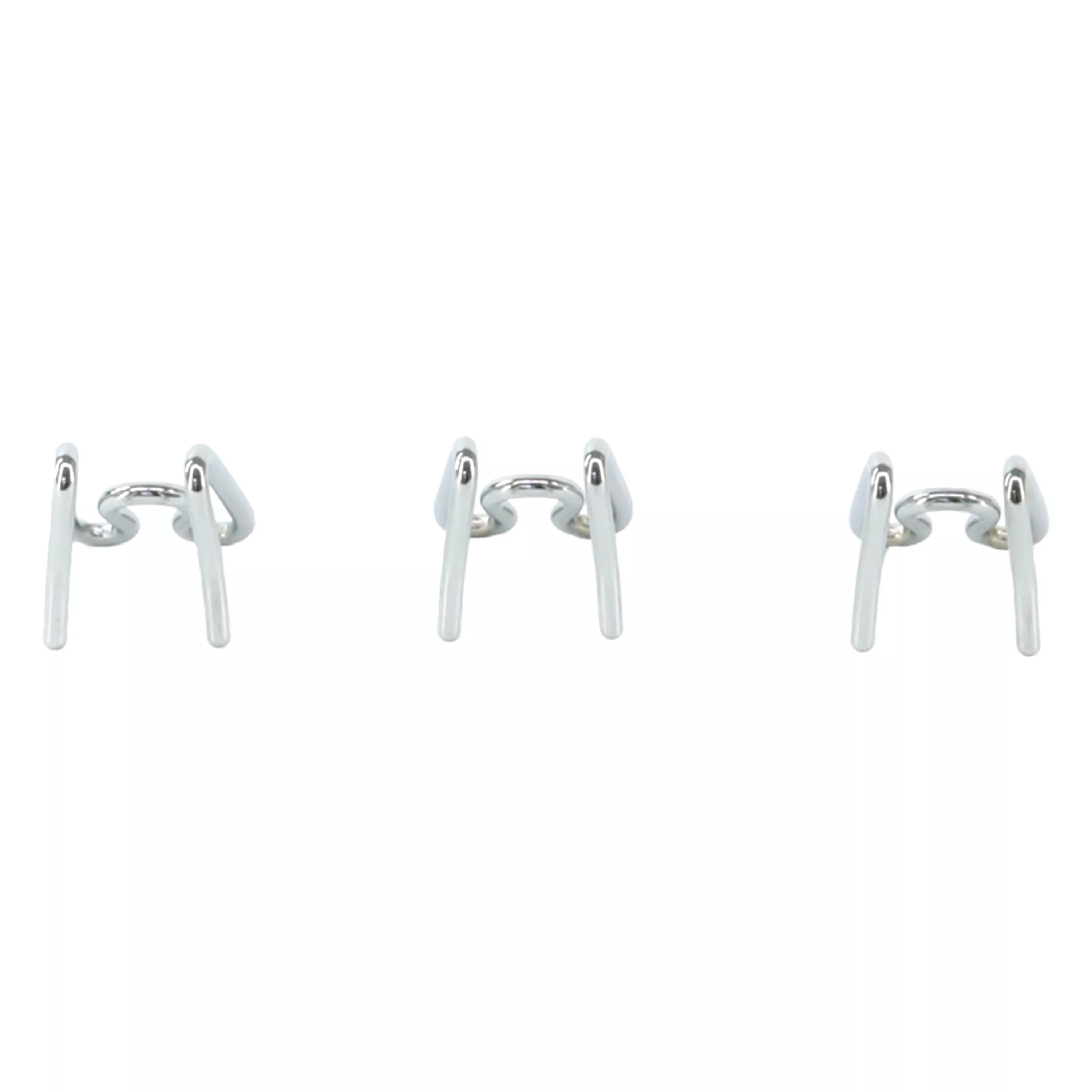 A set of extra prong links for a dog training collar is displayed against a white background. Three identical silver metal prong segments are shown in a horizontal row. Each segment has two inward‑facing rounded prongs and a curved outer bar with open‑ended connectors for attaching to other segments. The metal finish is smooth and reflective.